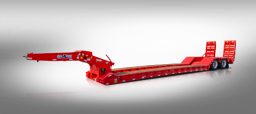 Red lowboy with hydraulic rear beavertail ramps